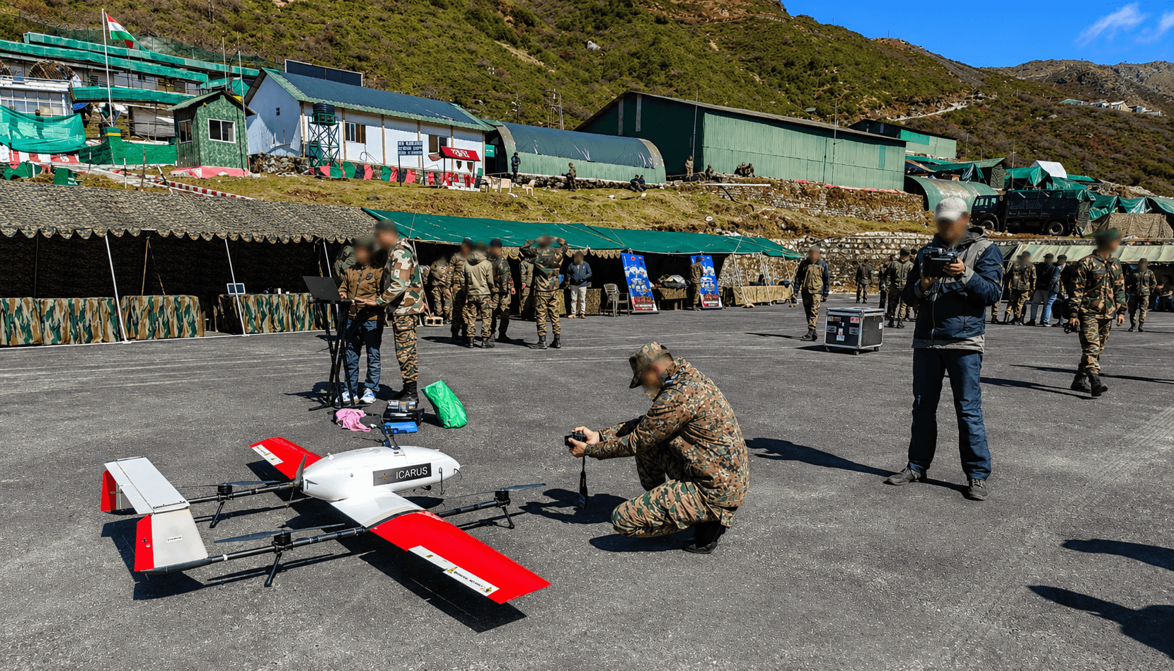 Weevils Drones Icarus VTOL on a high-altitude tarmac alongside personnel and operational hardware